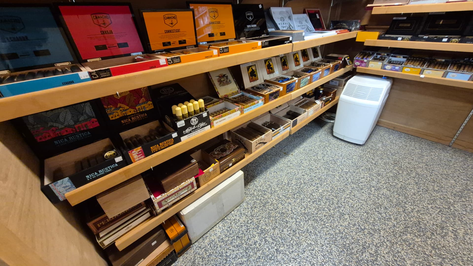 Humidor shelves of Camacho, Nica Rustica, Romeo y Julieta and more
